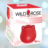 The packaging of the Icon Brands Wild Rose Rechargeable Suction Vibrator features an elegant red rose design, highlighting its seven modes and three speeds with the captivating tagline "Endless Orgasms." A softly blurred background with light bokeh enhances its elegance, and the device's rechargeable feature adds convenience.
